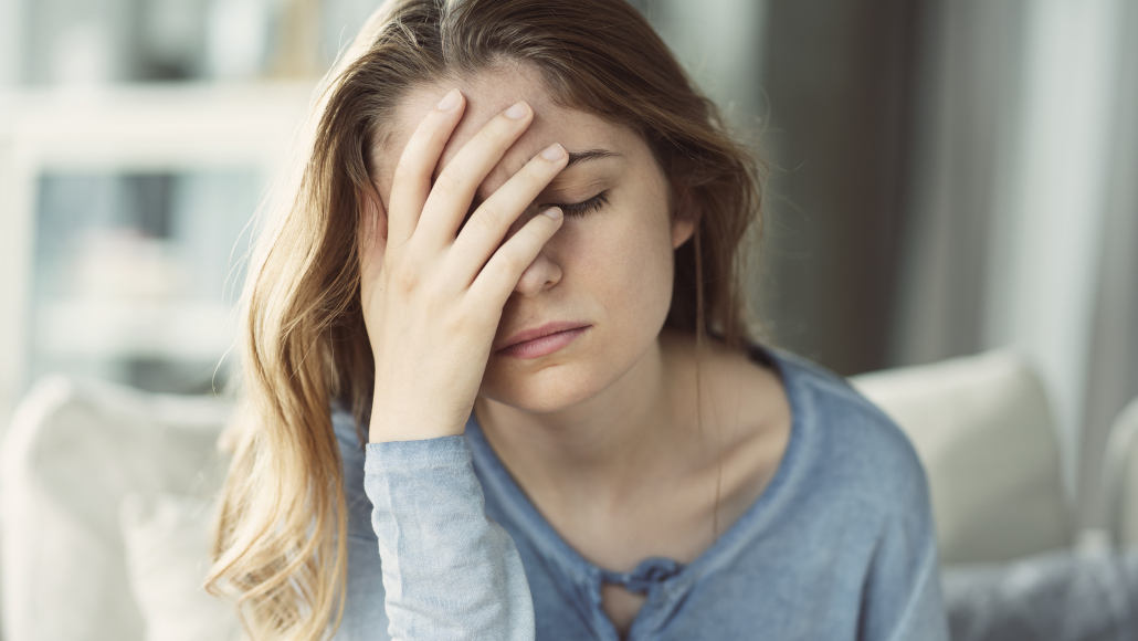Keto side effects: woman with nausea