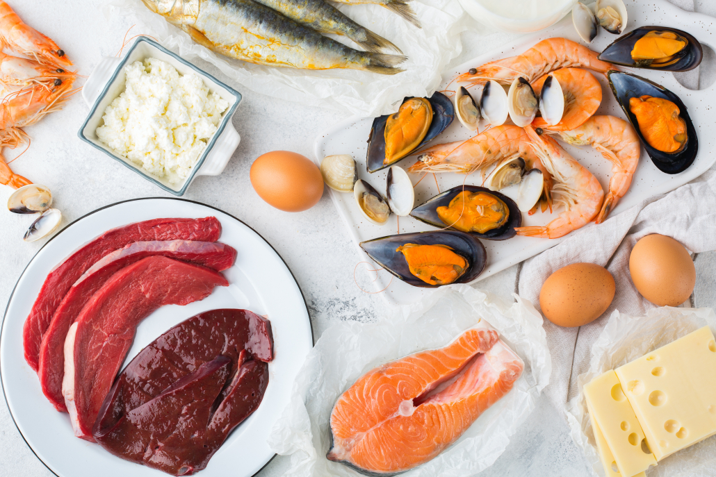 Balanced diet nutrition, healthy eating concept. Food sources rich in vitamin B12, cobalamin on a kitchen table. Top view flat lay background