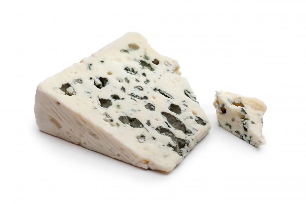 Slice of Roquefort cheese on white background