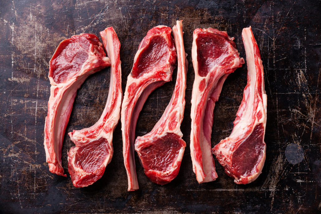 Raw fresh lamb ribs on dark background