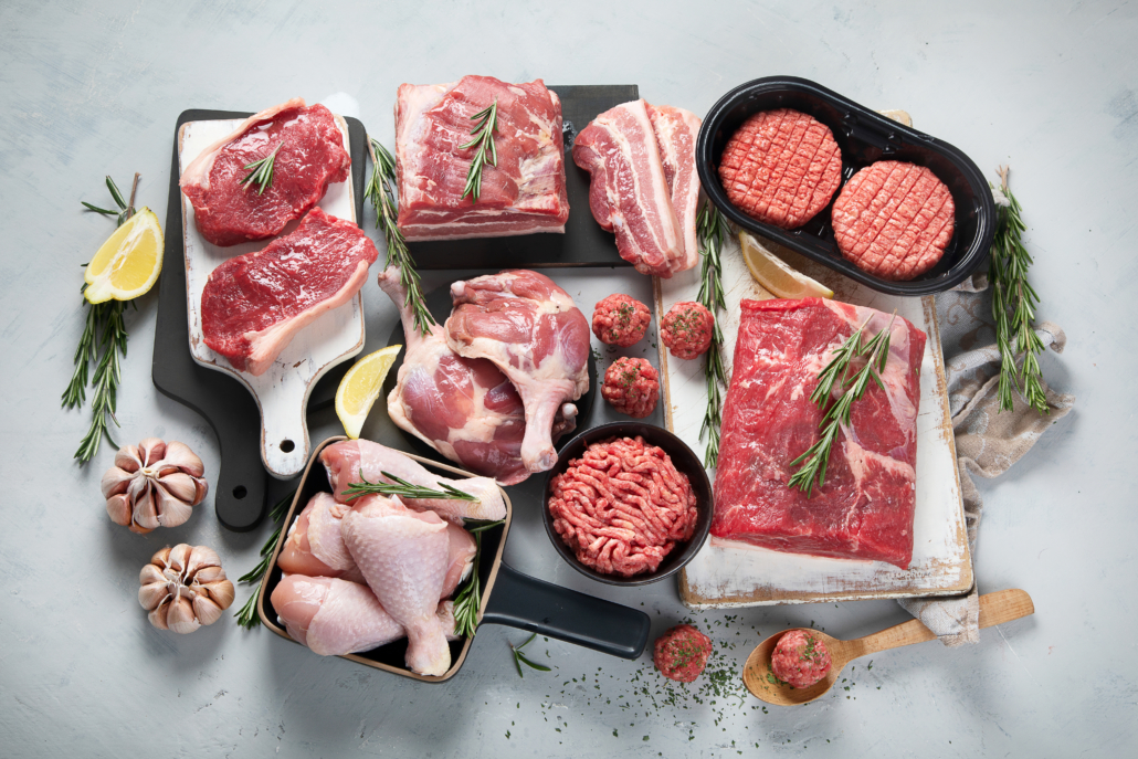 Assortment of raw meats on grey background. Top view, flat lay