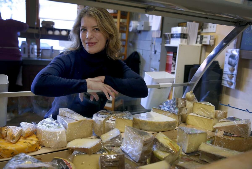 nina teicholz looking into a case of cheese