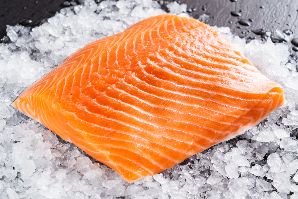 Raw salmon filet on the ice