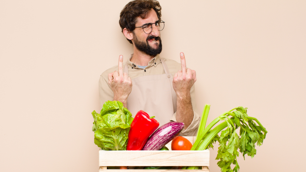 guy giving finger to vegetables