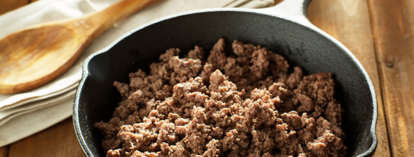 browned ground beef in cast iron skillet