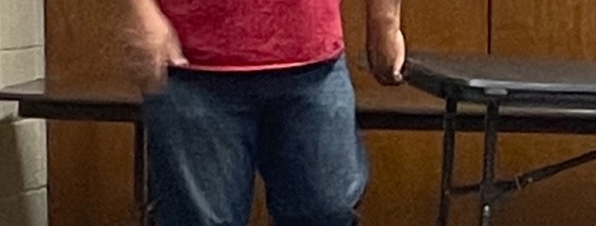 overweight man in red shirt