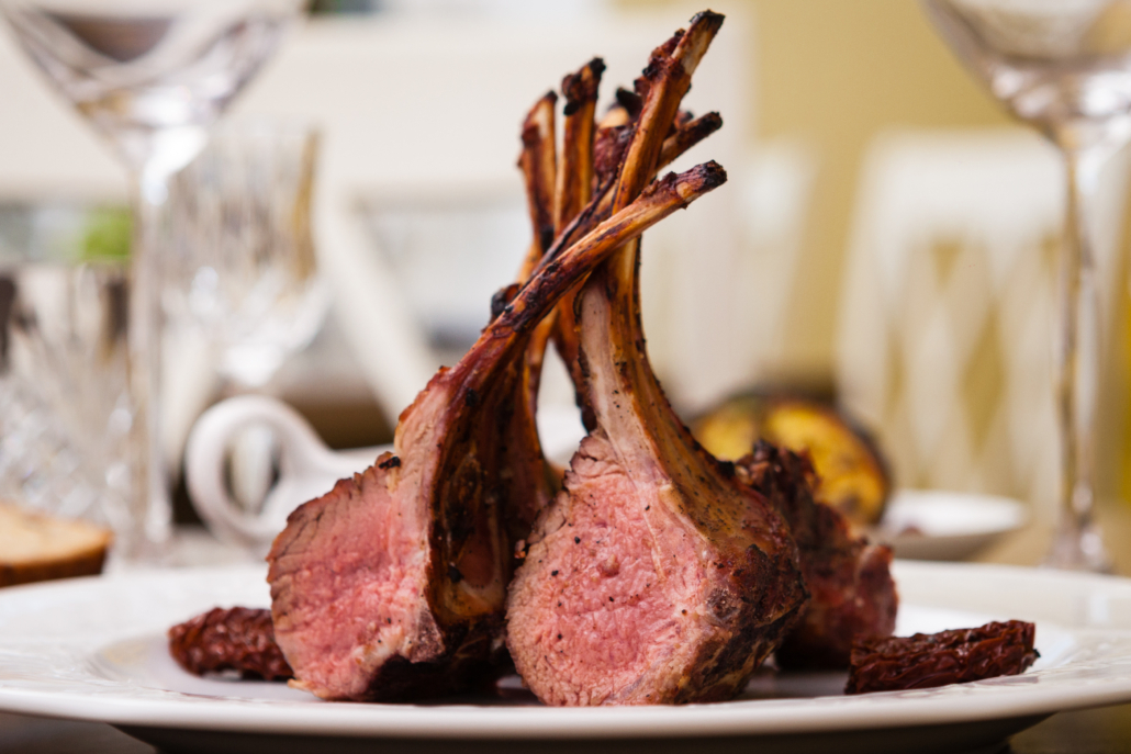 Lamb rack with limoncello glaze served on a plate