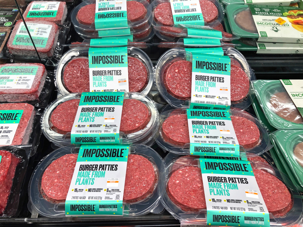 Alameda, CA - Nov 13, 2020: Grocery store refrigerator section with Impossible Burger brand plant based patties. Plant based proteins can be as healthy as animal based proteins.