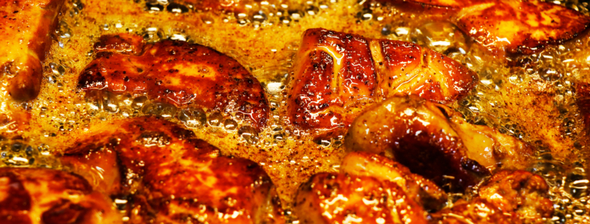 duck or goose foie gras cooking in a hot pan, oily and greasy delicacy food