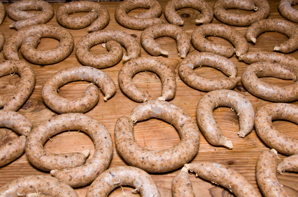 Horizontal view on wooden table full of curly liverwurst