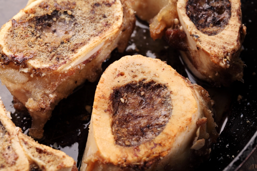Close-up of roasted marrow bones in a pan
