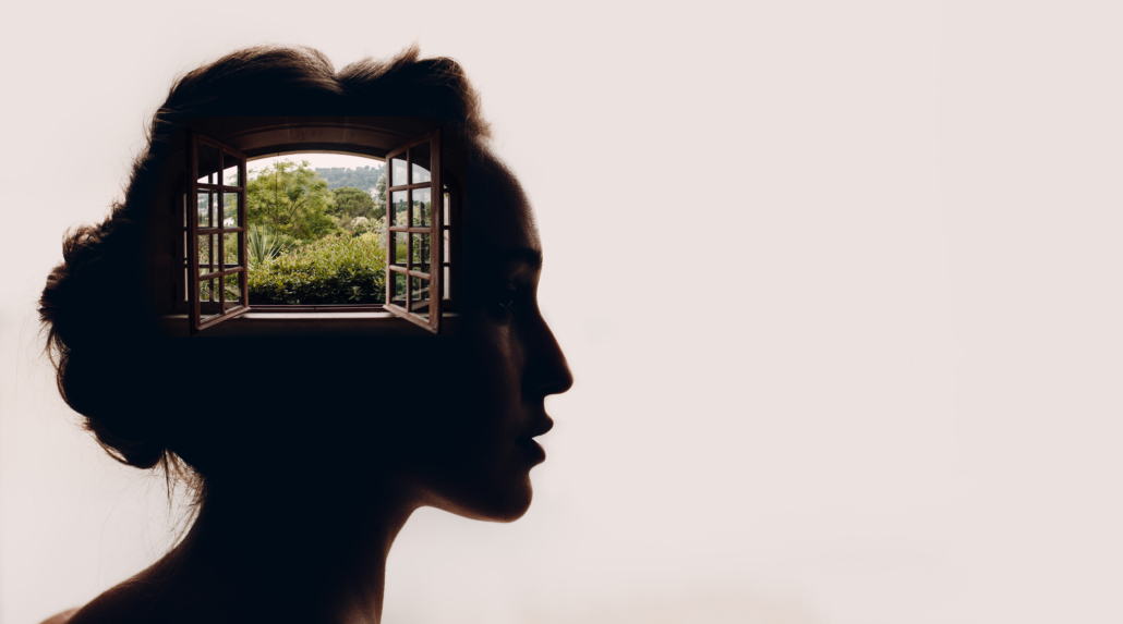 Beautiful woman with opened window with garden in her head.