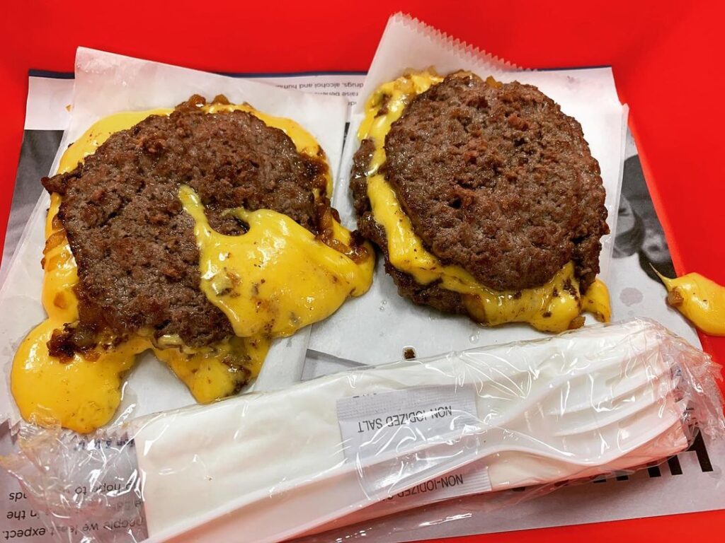 fast food burger patties with melted cheese