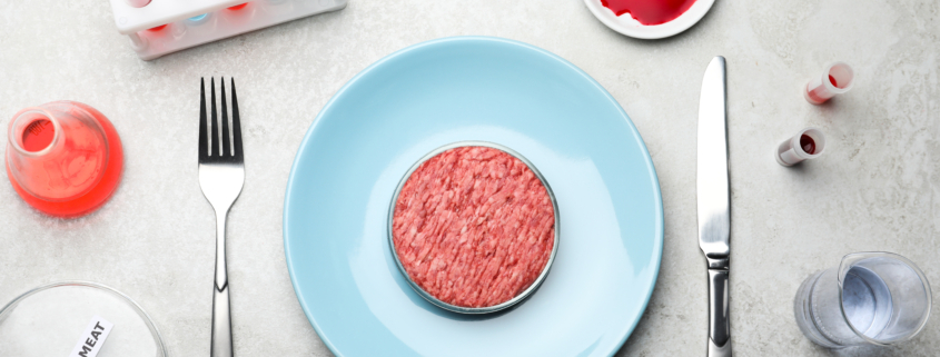 Cultured meat served on light grey lab table, flat lay