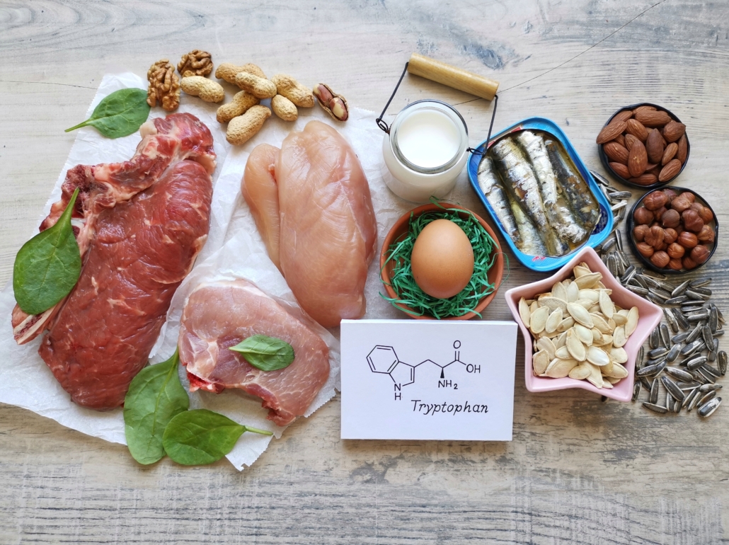 Tryptophan rich foods with structural chemical formula of essential amino acid tryptophan. Natural food sources of tryptophan include high protein foods like eggs, dairy products, meat, nuts, seeds.