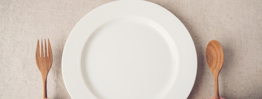 white plate with spoon and fork, Intermittent fasting concept, ketogenic diet, weight loss, diet